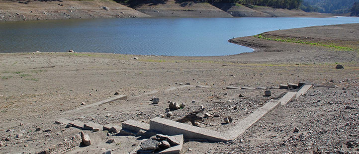 What is the name of one of the ghost towns that was buried under Lexington Reservoir?